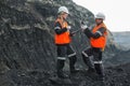 Workers with coal at open pit Royalty Free Stock Photo