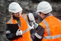 Workers with coal at open pit