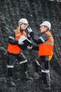 Workers with coal at open pit Royalty Free Stock Photo