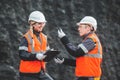 Workers with coal at open pit