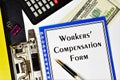 Workers` compensation form - text inscription on the form in the folder of the office Registrar. Royalty Free Stock Photo