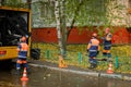 Workers conduct water pipe repair work in the street