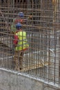 Workers constructing a rebar cage