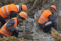 Workers at the construction site chop a jackhammer piles are cut