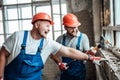Workers at a construction site destroy a windowsill Royalty Free Stock Photo
