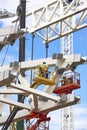 Workers on a construction site. Engineering and architectural infrastructure. Safety