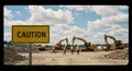 Workers at Construction Site with Excavators and Caution Sign Royalty Free Stock Photo
