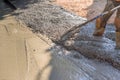 Workers in construction site with slump concrete ready mix trowel leveling a concrete for driveway Royalty Free Stock Photo