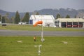 Workers controlling the direction of the wind on the runway