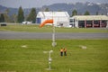 Workers controlling the direction of the wind on the runway