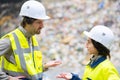 workers in conversation in refuse center Royalty Free Stock Photo