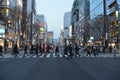 the workers are crossing the road in Japan in the morning