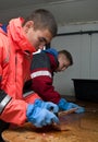 Workers cutting fish