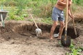 Workers dig a pit for a septic tank