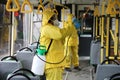 Workers disinfecting bus Royalty Free Stock Photo