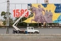 Workers dismantle a festive panel at the Square of the Fallen Fighters in Volgograd.