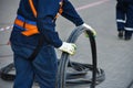 Workers dismantle the telecommunication cable in the well