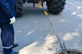 Workers dismantle the telecommunication cable in the well