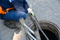 Workers dismantle the telecommunication cable in the well