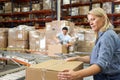 Workers In Distribution Warehouse Royalty Free Stock Photo
