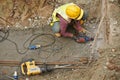 Workers drilling concrete using mobile drilling machine