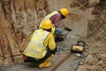 Workers drilling concrete using mobile drilling machine