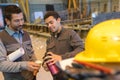 Workers drinking coffee at warehouse