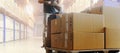 Workers Driving Electric Forklift Pallet Jack Unloading Packaging Boxes in The Warehouse. Storage Warehouse Shipment Cargo Boxes. Royalty Free Stock Photo