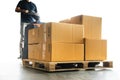 Workers Driving Forklift Pallet Jack Unloading Packaging Boxes on Pallet. Cardboard Boxes. Shipping Supplies Warehouse. Shipment Royalty Free Stock Photo