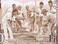 Workers drying grain from old Ghanaian money