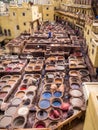 Workers are dyeing leather at the tannery in Fez, Fes el Bali Royalty Free Stock Photo