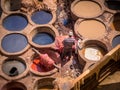 Workers are dyeing leather at the tannery in Fez, Fes el Bali Royalty Free Stock Photo