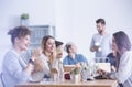 Workers eating at the office