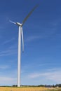 Workers on the end of a wind turbine blade in rural Ontario, Can