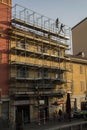 Workers engaged in assembling a scaffolding