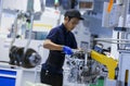 Workers at engine assembly plant