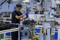 Workers at engine assembly plant