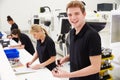 Workers In Engineering Factory Checking Component Quality