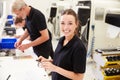 Workers In Engineering Factory Checking Component Quality