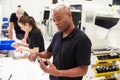 Workers In Engineering Factory Checking Component Quality Royalty Free Stock Photo