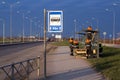 Workers equip a new public transport stop in a new residential area