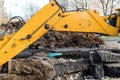 Workers excavate the pit with an excavator. Road repair.