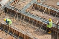 Workers fabricating ground beam reinforcement bar Royalty Free Stock Photo