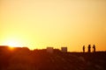 Workers in Field at Sunset Royalty Free Stock Photo