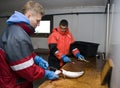 Workers filleting fish