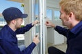 workers fitting a window Royalty Free Stock Photo