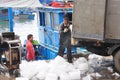 Workers are grinding ice to preserve tuna fish in the Hon Ro seaport, Nha Trang city