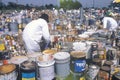 Workers handling toxic household wastes at waste cleanup site on Earth Day at the Unocal plant in Wilmington, Los Angeles, CA