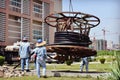 Workers hoist communication cable