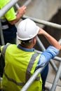 Workers inspecting construction works on a scaffold Royalty Free Stock Photo